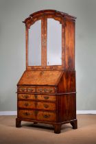A GEORGE II WALNUT BUREAU BOOKCASE C.1725-30 with cross and feather banding, the Chinese
