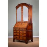 A GEORGE II WALNUT BUREAU BOOKCASE C.1725-30 with cross and feather banding, the Chinese