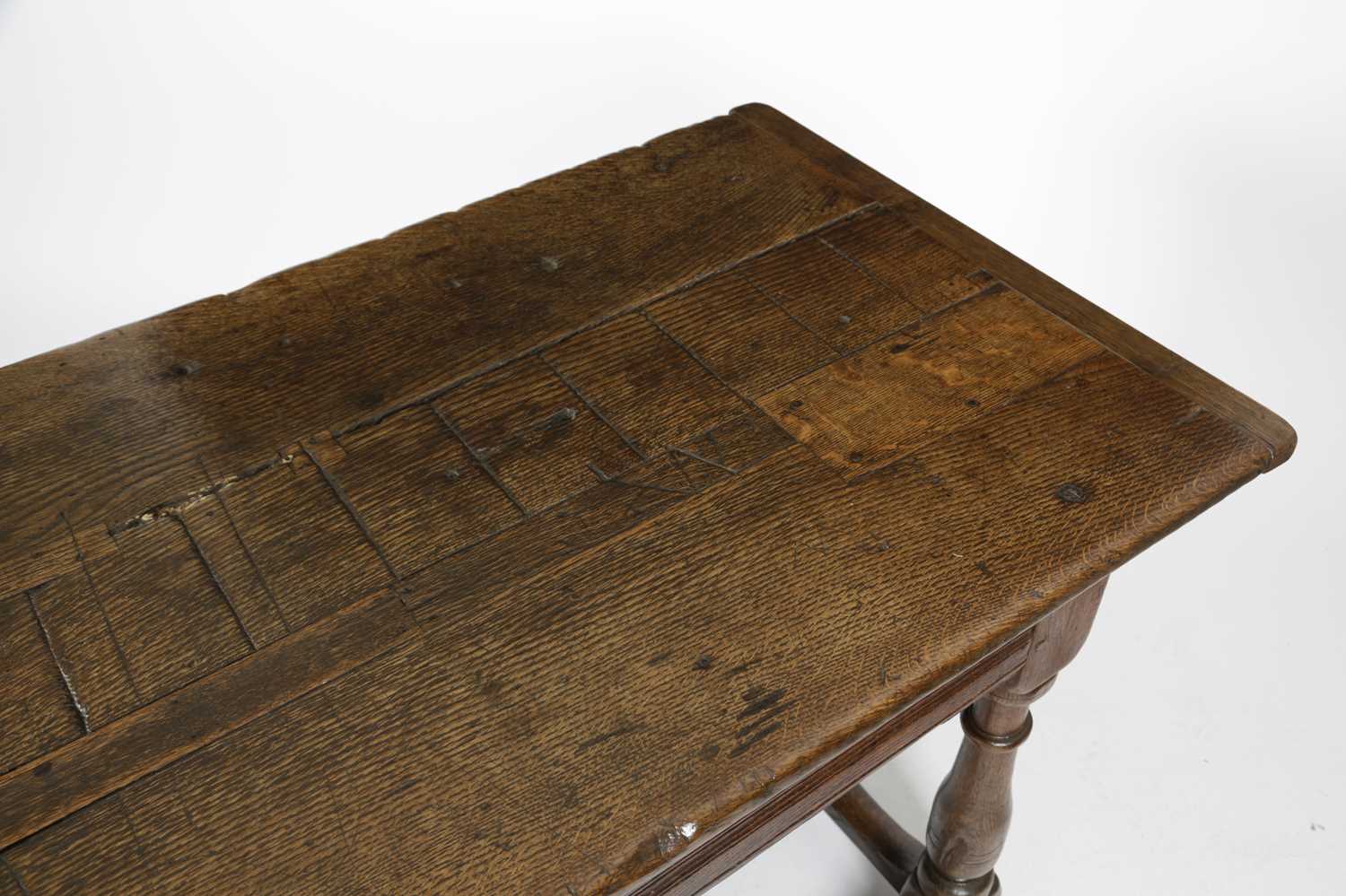 AN OAK REFECTORY TABLE LATE 17TH CENTURY AND LATER the boarded top with cleated ends, above a - Image 4 of 4