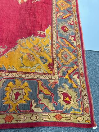 AN USHAK CARPET OF UNUSUAL SIZE CENTRAL WEST ANATOLIA, C.1900 the plain raspberry field centered - Image 12 of 14