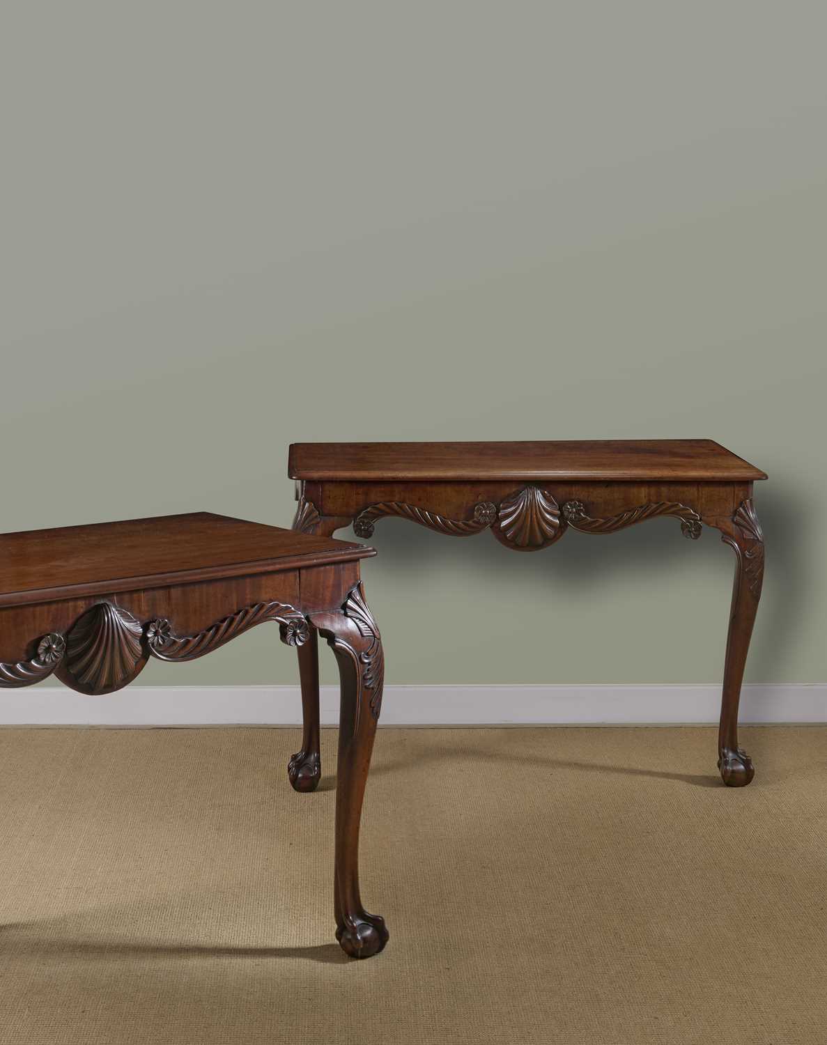 A FINE PAIR OF GEORGE II IRISH MAHOGANY CONSOLE TABLES C.1750 each with a moulded edge top above a