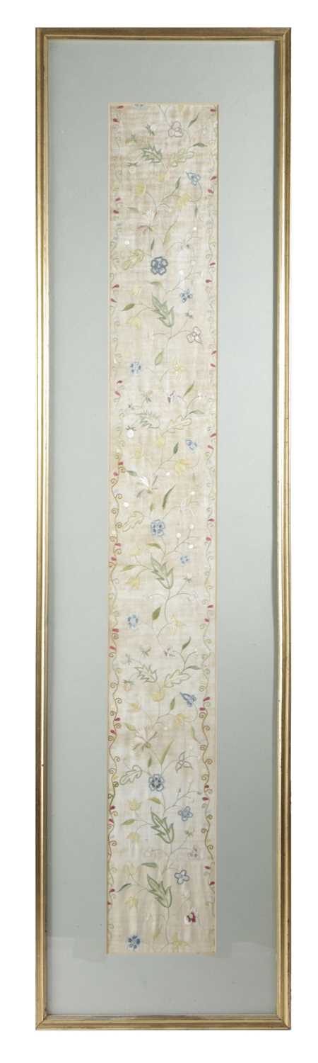 A SILK NEEDLEWORK PANEL EARLY 19TH CENTURY worked with meandering floral foliage inside a wavy