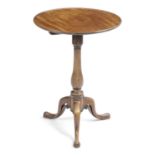 A GEORGE III MAHOGANY TRIPOD TABLE C.1770 the circular dished tilt-top on a baluster column and