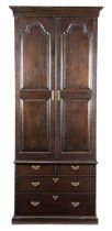 A GEORGE III OAK ESTATE CUPBOARD 18TH CENTURY with a pair of fielded panelled doors enclosing
