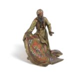 AN AUSTRIAN COLD PAINTED BRONZE FIGURE OF AN ARAB CARPET SELLER IN THE MANNER OF FRANZ BERGMAN, LATE