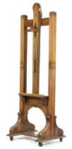 A FINE VICTORIAN WALNUT EASEL BY JOUBERT, LONDON, LATE 19TH CENTURY of architectural form, with a