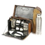 A BROWN LEATHER PICNIC SET EARLY 20TH CENTURY the hinged lid impressed with owners name 'B.