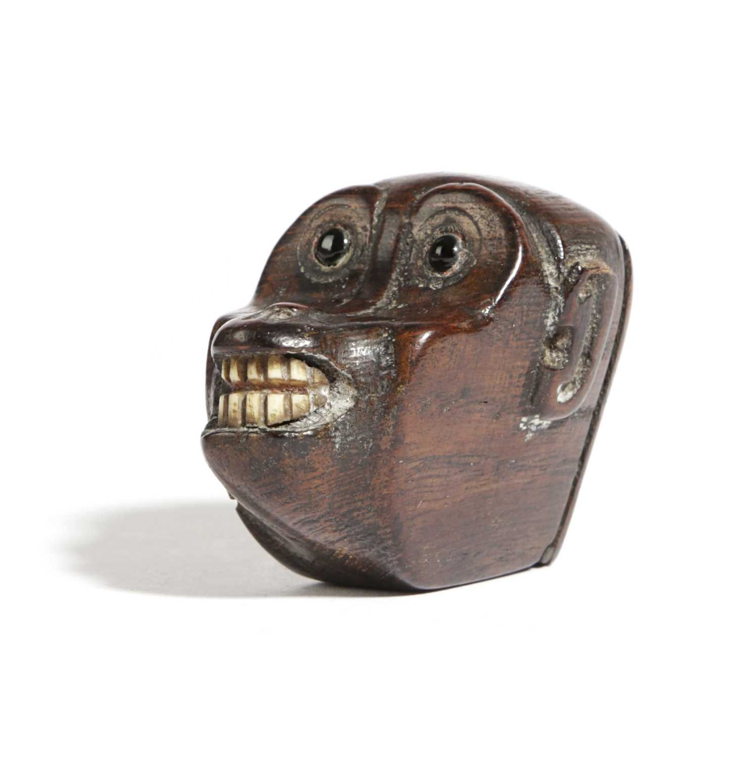 A TREEN MONKEY'S HEAD SNUFF BOX LATE 18TH / EARLY 19TH CENTURY with glass eyes and bone teeth,