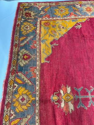 AN USHAK CARPET OF UNUSUAL SIZE CENTRAL WEST ANATOLIA, C.1900 the plain raspberry field centered - Image 7 of 14