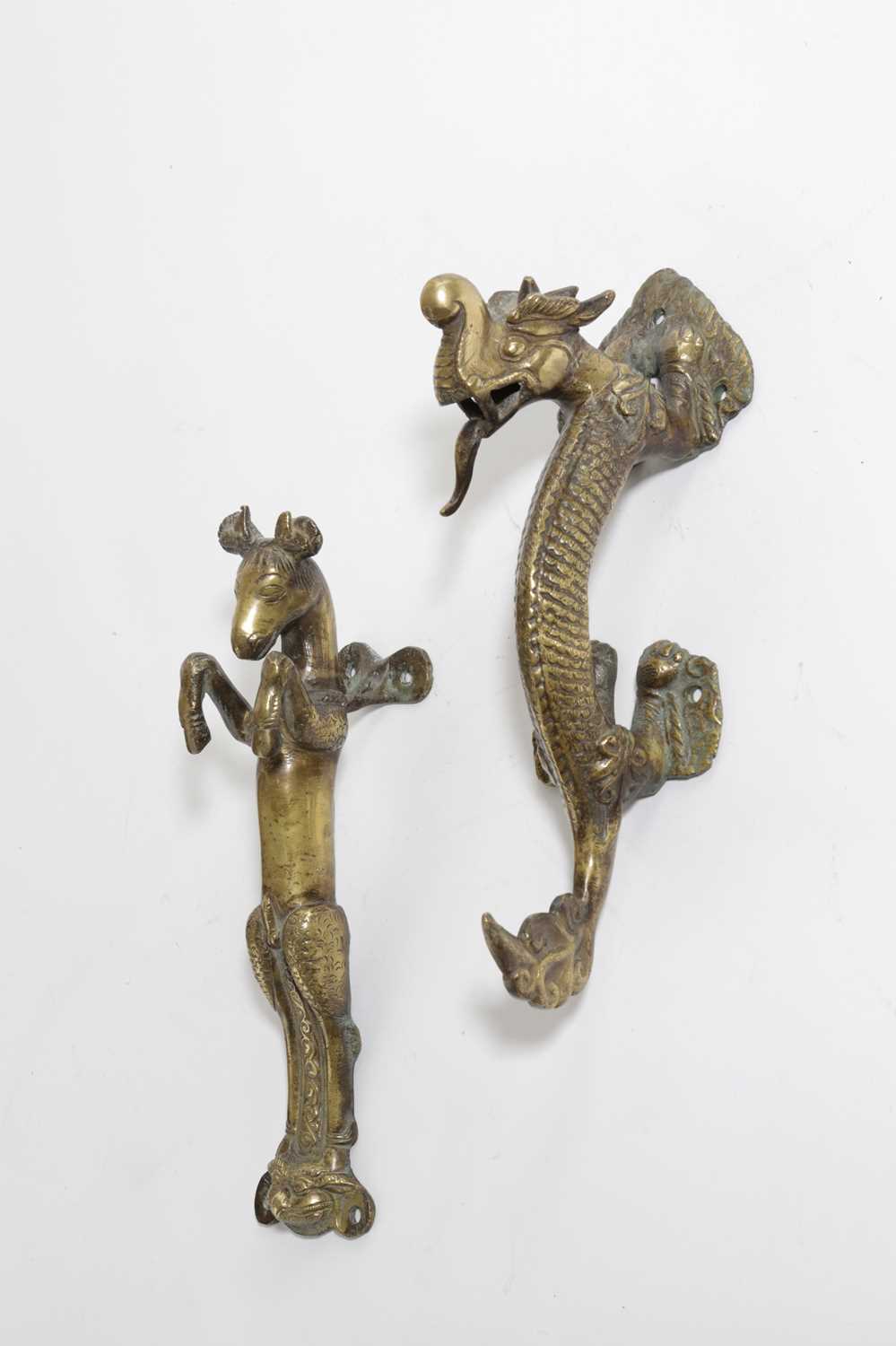 TWO EASTERN BRONZE DOOR HANDLES POSSIBLY INDIAN OR TIBETAN, 18TH OR 19TH CENTURY one cast as a scaly