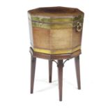 A GEORGE III MAHOGANY AND BRASS BOUND OCTAGONAL WINE COOLER LATE 18TH CENTURY with a lead lined