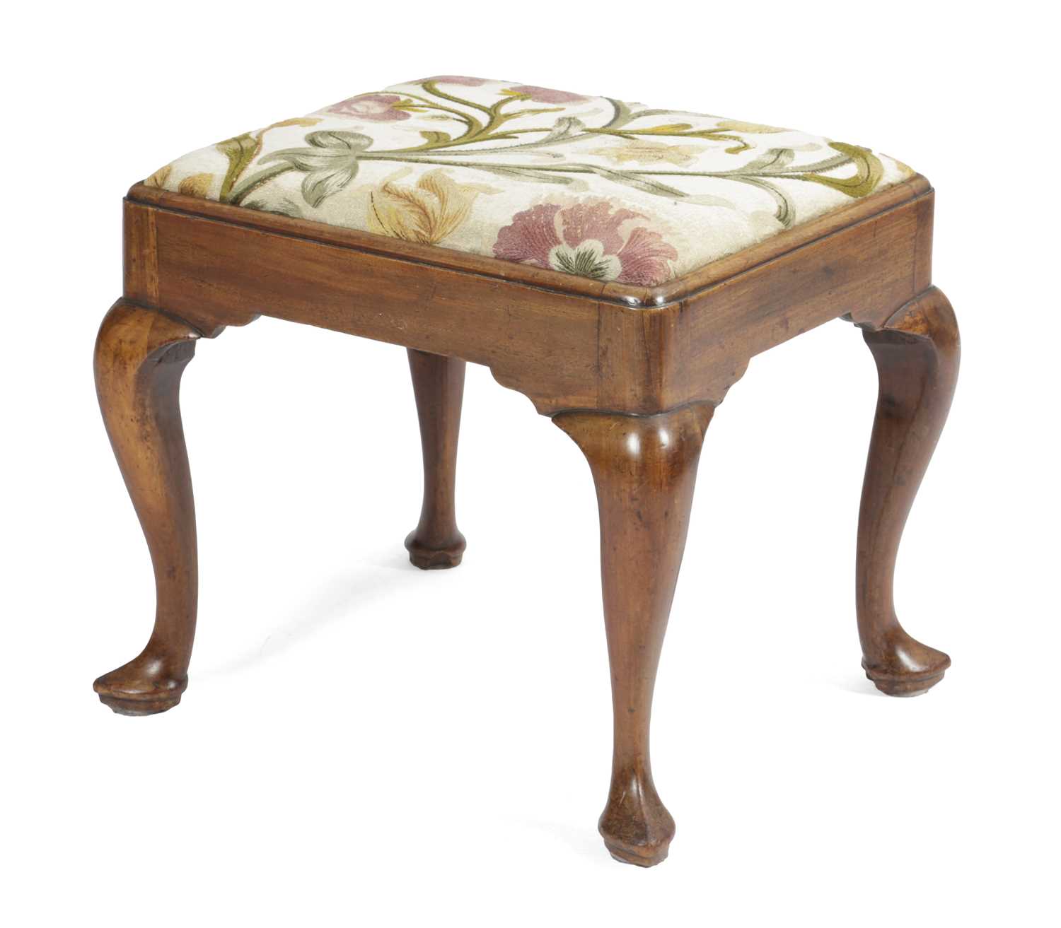 A GEORGE II WALNUT STOOL C.1740 the rectangular seat with floral embroidered upholstery above