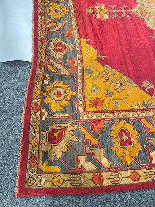 AN USHAK CARPET OF UNUSUAL SIZE CENTRAL WEST ANATOLIA, C.1900 the plain raspberry field centered - Image 2 of 14
