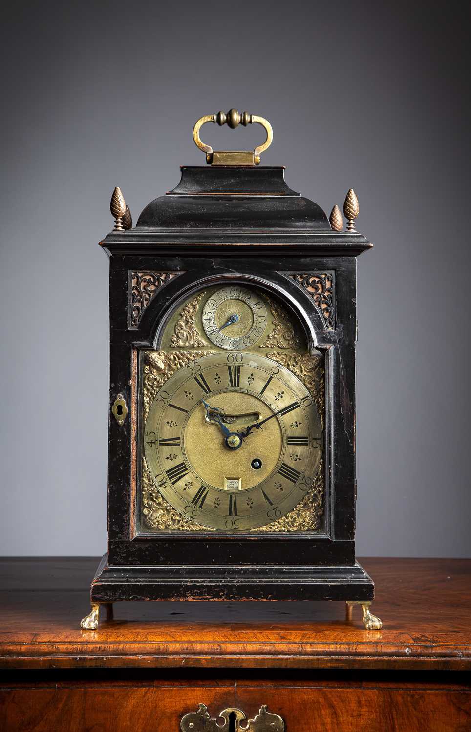 A GEORGE I EBONISED BRACKET CLOCK BY SIMON DE CHARMES, LONDON, C.1720 the brass eight day single