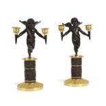 A PAIR OF FRENCH GILT AND PATINATED BRONZE CANDELABRA MID-19TH CENTURY each modelled as a cherub