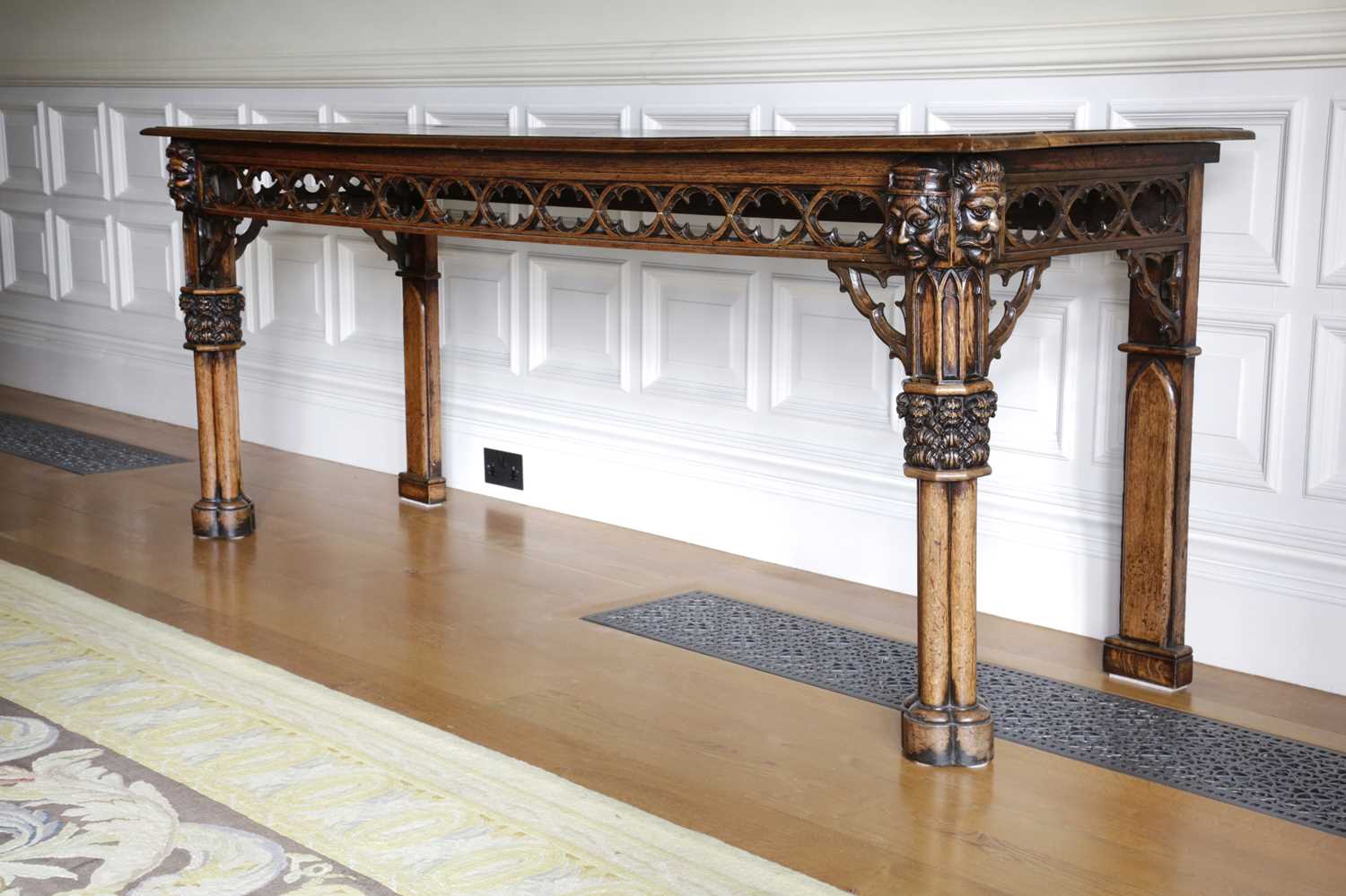 A FINE GEORGE IV OAK GOTHIC REVIVAL SERVING TABLE IN THE MANNER OF A.W.N. PUGIN, C.1830 the frieze