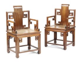 A PAIR OF CHINESE HUALI ARMCHAIRS IN MING STYLE, 20TH CENTURY each decorated with scrolls and with a