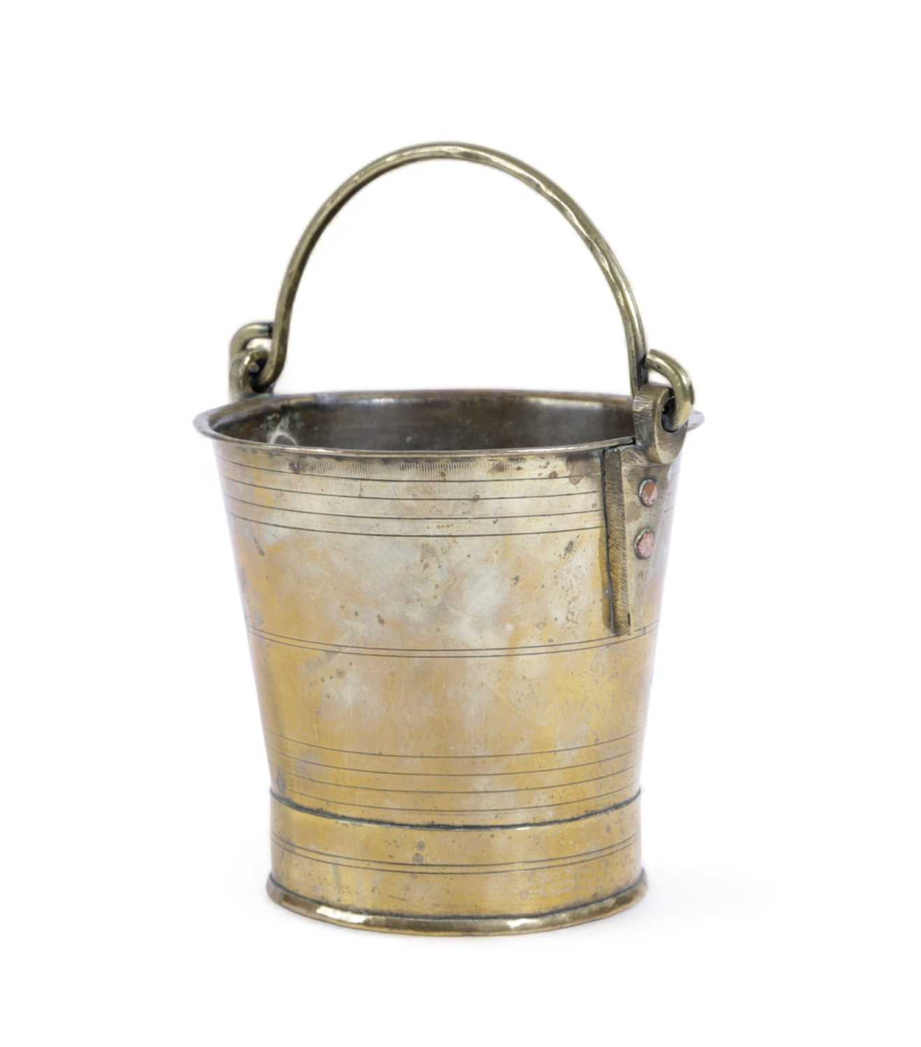 A REGENCY BRASS BUCKET C.1820 with lathe-turned ring decoration and a swing handle 27.5cm high, 29cm