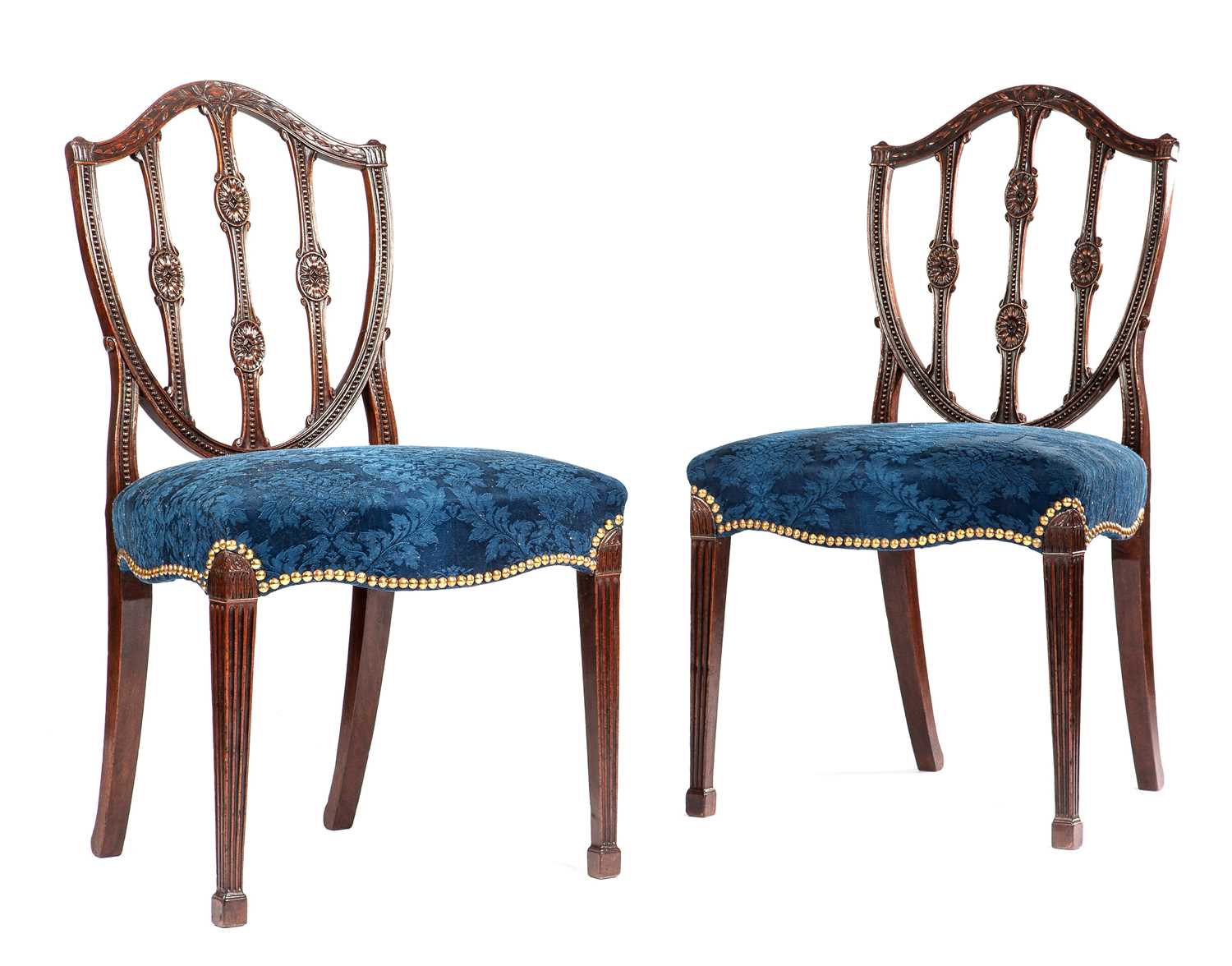 A PAIR OF GEORGE III MAHOGANY SIDE CHAIRS HEPPLEWHITE PERIOD, C.1780 each with a shield-shaped