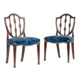 A PAIR OF GEORGE III MAHOGANY SIDE CHAIRS HEPPLEWHITE PERIOD, C.1780 each with a shield-shaped