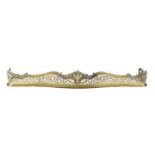 A BRASS SERPENTINE FIRE FENDER IN GEORGE II ROCOCO STYLE, 19TH CENTURY with pierced scrolling