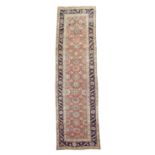 A BIDJAR RUNNER PERSIAN KURDISTAN, C.1900 the madder field of Mina Khani design enclosed by indigo