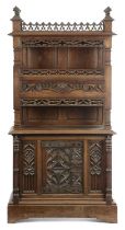 AN OAK GOTHIC REVIVAL CABINET 19TH CENTURY decorated with panels of tracery, the raised top with a