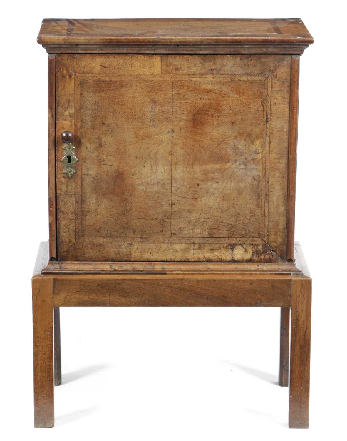 A QUEEN ANNE WALNUT SPICE CUPBOARD EARLY 18TH CENTURY with cross and feather banding, the hinged