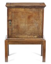 A QUEEN ANNE WALNUT SPICE CUPBOARD EARLY 18TH CENTURY with cross and feather banding, the hinged