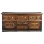 A CHARLES II OAK DRESSER LATE 17TH CENTURY the top with a moulded edge above a 'T' arrangement of