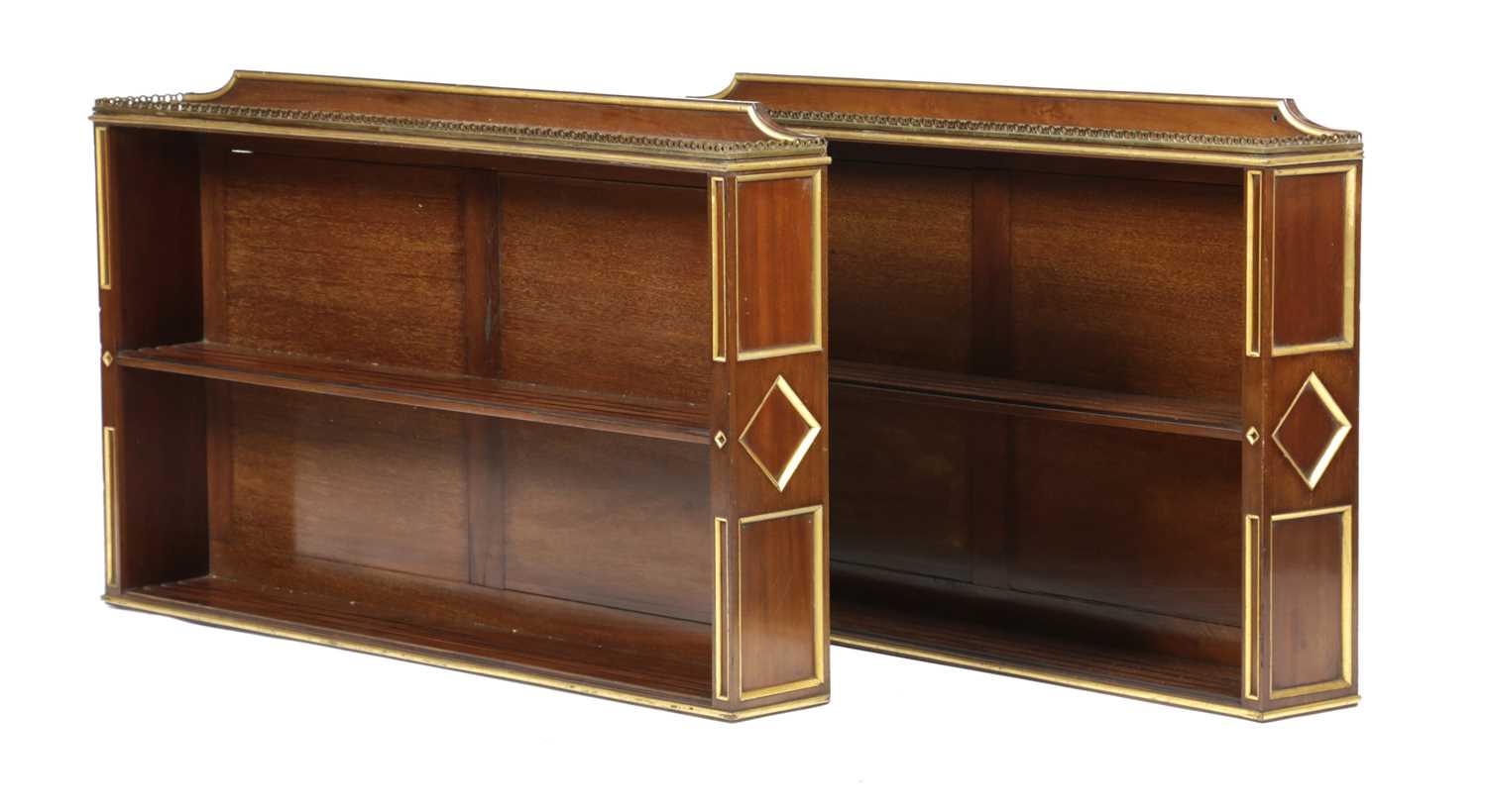 A PAIR OF NORTH EUROPEAN MAHOGANY WALL SHELVES BALTIC, 19TH CENTURY with parcel-gilt decoration, the