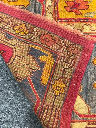 AN USHAK CARPET OF UNUSUAL SIZE CENTRAL WEST ANATOLIA, C.1900 the plain raspberry field centered - Image 4 of 14