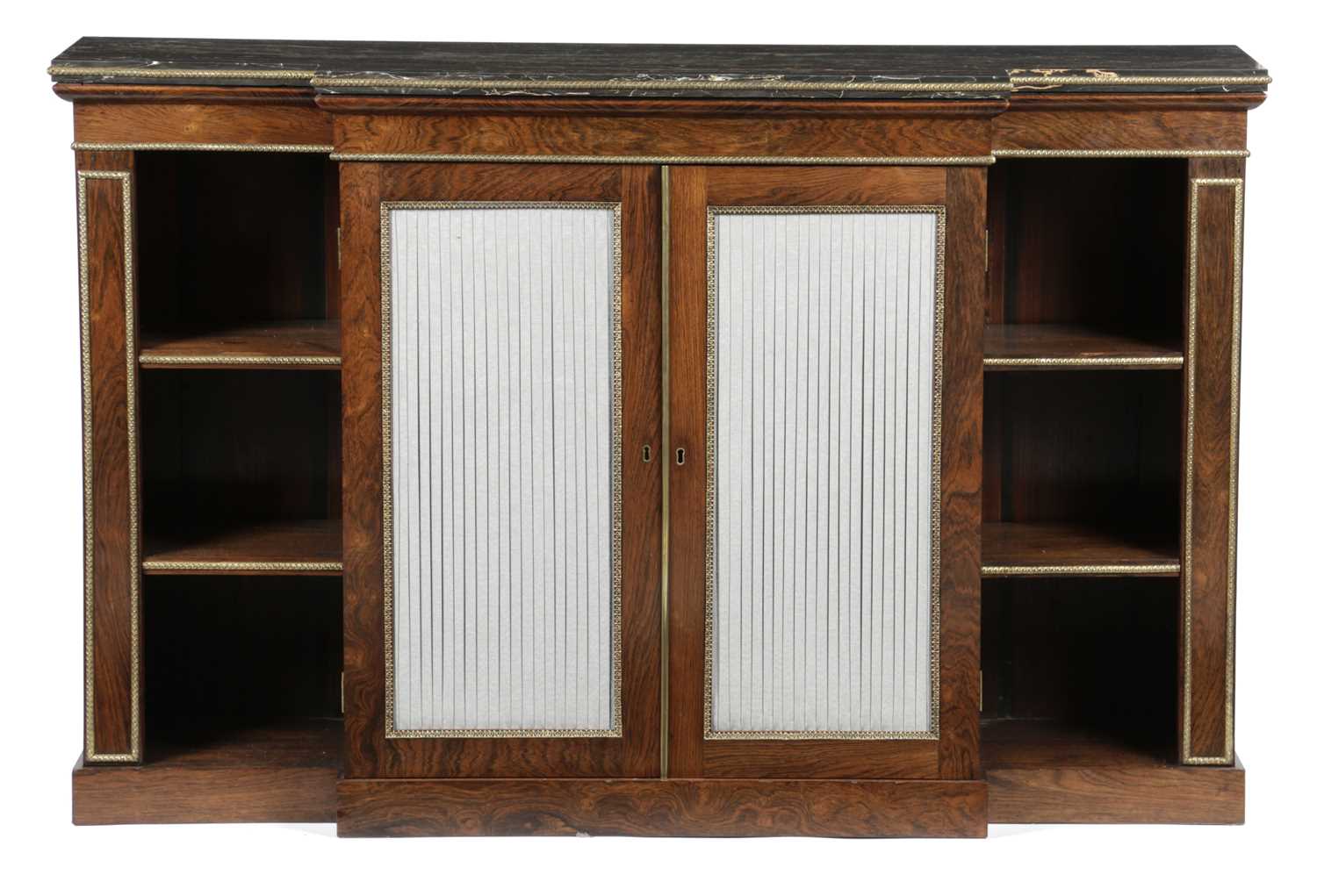 λ A REGENCY ROSEWOOD BREAKFRONT SIDE CABINET IN THE MANNER OF GILLOWS, EARLY 19TH CENTURY AND