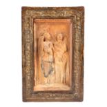 AN ITALIAN TERRACOTTA PLAQUE IN RENAISSANCE STYLE, TUSCAN, POSSIBLY 15TH CENTURY depicting two