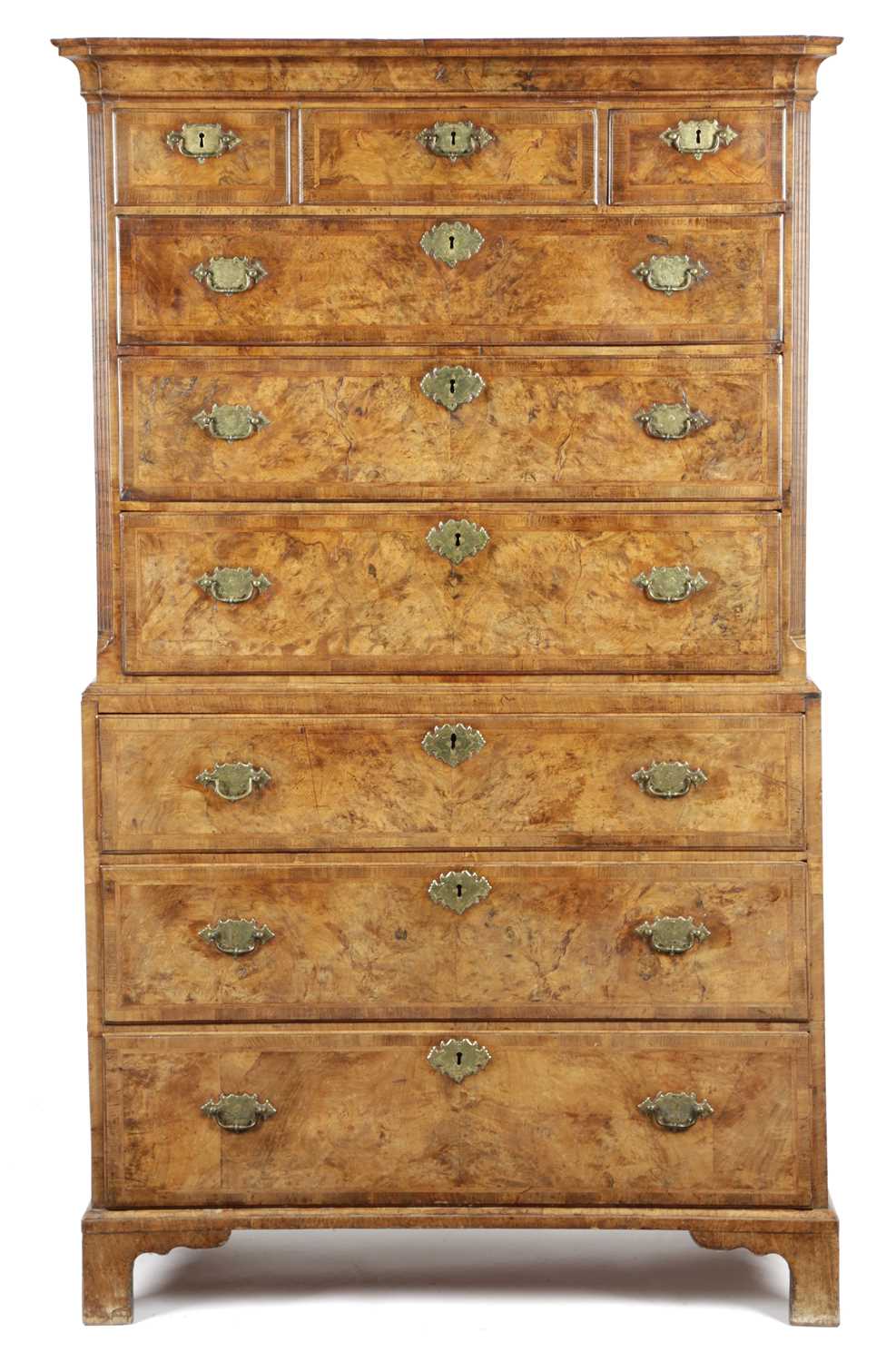 A GEORGE II WALNUT CHEST ON CHEST C.1735 with cross and feather banding and fitted with three