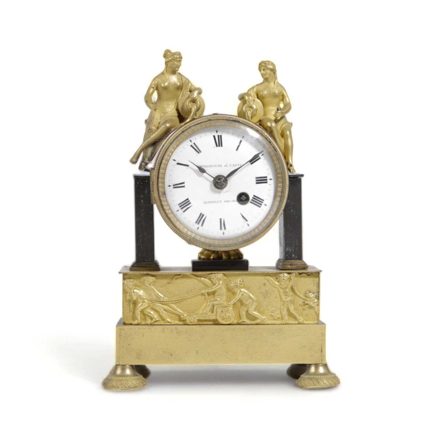 A REGENCY GILT AND PATINATED BRONZE MANTEL TIMEPIECE RETAILED BY DWERRIHOUSE & CARTER, BERKELEY