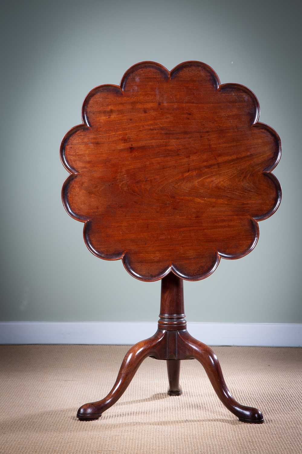 A GEORGE II TRIPOD TABLE MID-18TH CENTURY the dodecahedral lobed tilt-top revolving on a birdcage,