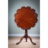 A GEORGE II TRIPOD TABLE MID-18TH CENTURY the dodecahedral lobed tilt-top revolving on a birdcage,