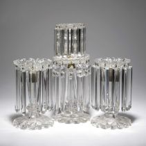 A REGENCY CUT GLASS TWO-TIER TABLE LUSTRE CANDSTICKS EARLY 19TH CENTURY with a flared nozzle, a