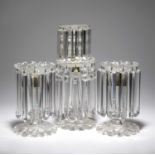 A REGENCY CUT GLASS TWO-TIER TABLE LUSTRE CANDSTICKS EARLY 19TH CENTURY with a flared nozzle, a