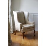 A PAIR WALNUT WING ARMCHAIRS IN QUEEN ANNE STYLE, LATE 19TH CENTURY each with an upholstered back,
