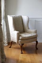A PAIR WALNUT WING ARMCHAIRS IN QUEEN ANNE STYLE, LATE 19TH CENTURY each with an upholstered back,