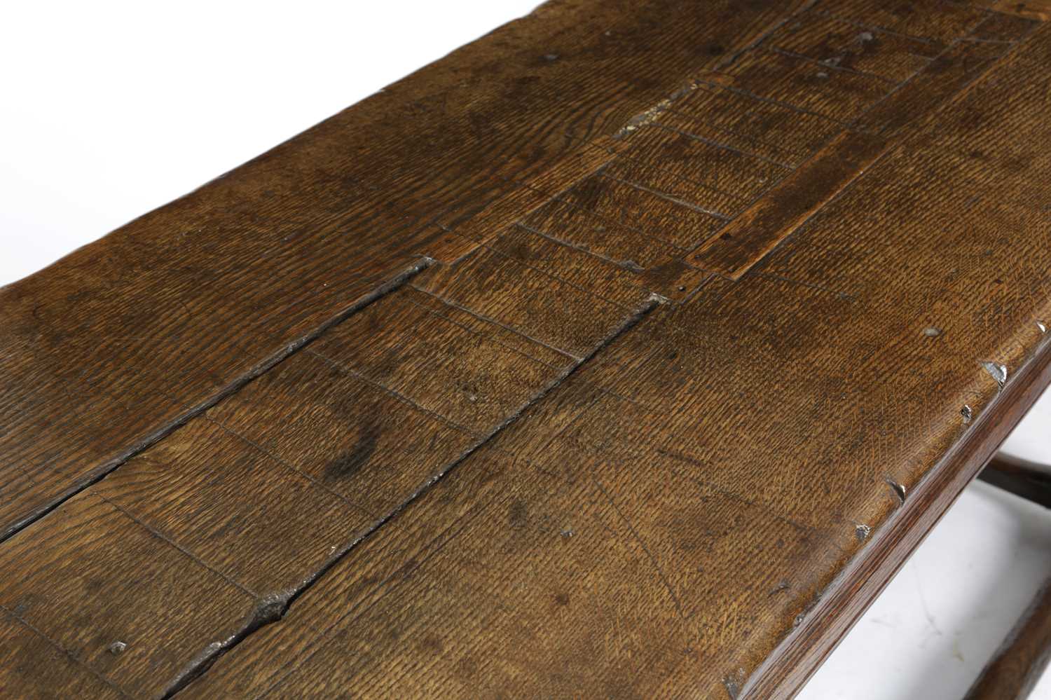 AN OAK REFECTORY TABLE LATE 17TH CENTURY AND LATER the boarded top with cleated ends, above a - Image 3 of 4