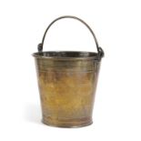 A SMALL REGENCY BRASS BUCKET C.1820 with lathe-turned ring and textured decoration, and a swing