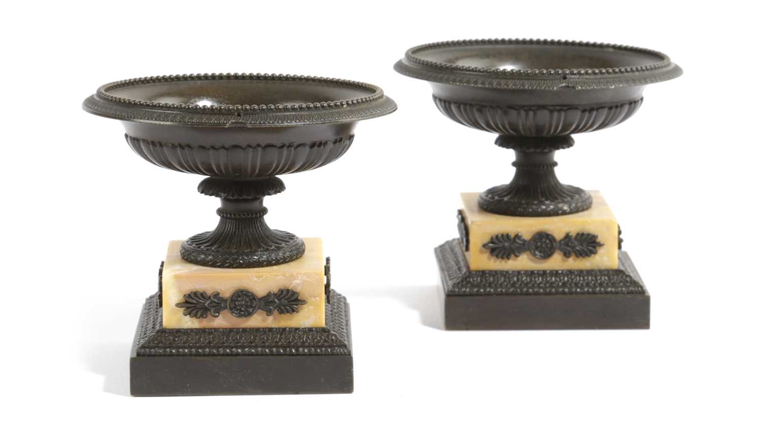 A PAIR OF FRENCH BRONZE AND SIENA MARBLE TAZZE EARLY 19TH CENTURY each with a beaded rim, above stop