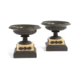 A PAIR OF FRENCH BRONZE AND SIENA MARBLE TAZZE EARLY 19TH CENTURY each with a beaded rim, above stop