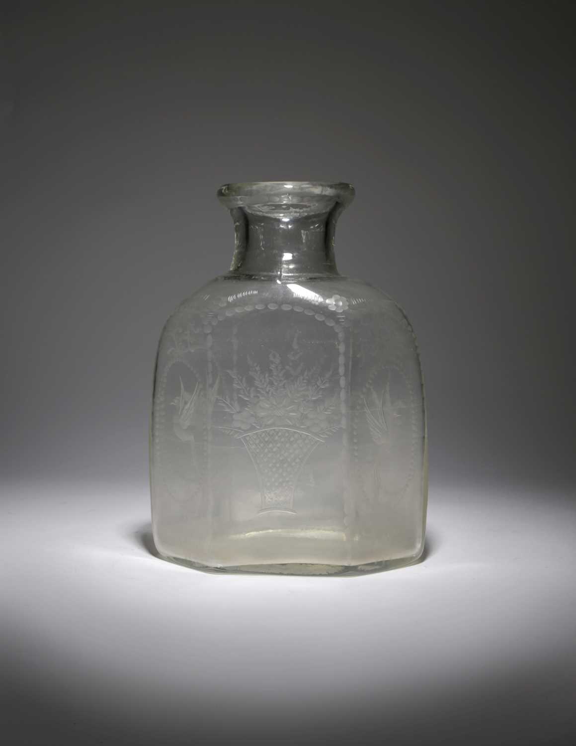 A LARGE BOHEMIAN GLASS CARAFE OR BOTTLE 19TH CENTURY of flattened hexagonal form engraved with