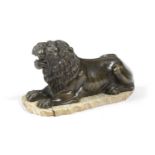A FRENCH BRONZE MODEL OF A RECUMBENT LION EARLY 19TH CENTURY later mounted on a slice of mammoth