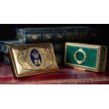 TWO GILT METAL SNUFF BOXES one with an oval panel of blue enamel applied with a coronet and the