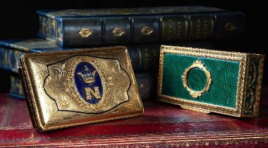TWO GILT METAL SNUFF BOXES one with an oval panel of blue enamel applied with a coronet and the
